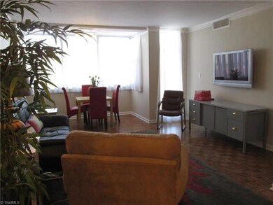 This view shows the open space available for dining room and living furniture arrangement. The dining room can also be located just beyond the French doors at entry.
