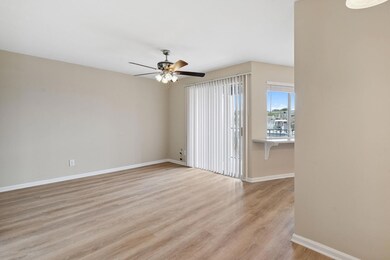 Empty room with light wood-style floors and a cei