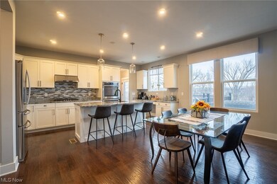 Dining area with dark hardwood / wood-style floors