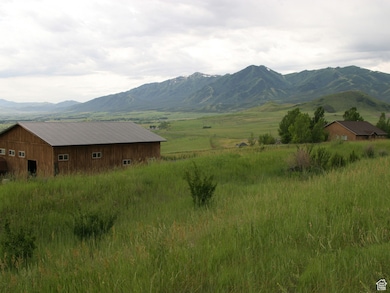 View of mountain background featuring rural landscape