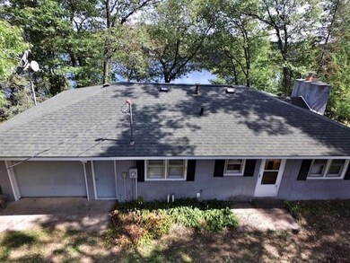 Single car attached garage offer storage for the lake toys.  Roof was replaced in 2012.