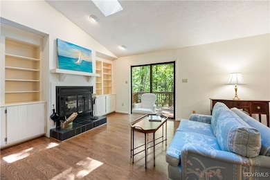Wood burning fireplace, bookcases with storage bel