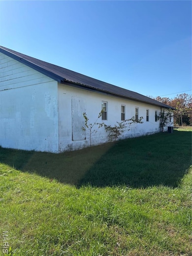 View of home's exterior with a lawn