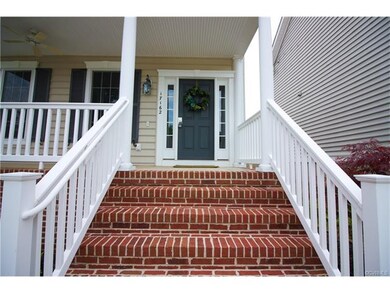 Grand entrance with brick & vinyl
