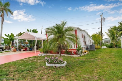 View of grassy yard featuring a gazebo, central ai