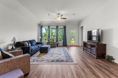 The light and bright living room is open to the ki