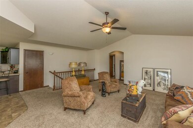 Great room area with vaulted ceiling.