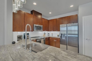 Kitchen featuring appliances with stainless steel 