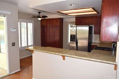 OPEN KITCHEN WITH GRANITE COUNTER TOPS