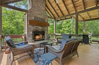 Enjoy a wood burning fire all four seasons on the serene covered porch