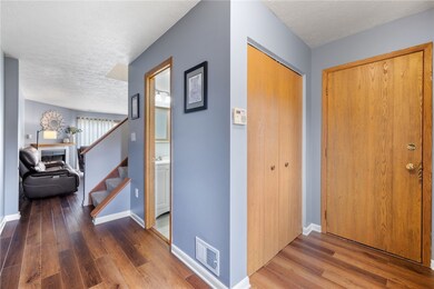 Entryway has a large coat closet and access to the garage. Powder Room access as well.