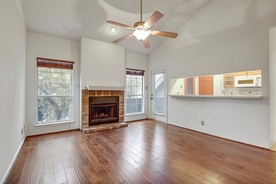Unfurnished living room with a ceiling fan, a fir