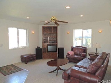 Living Room with recesssed lighting and wall sconc