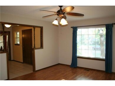 Living Room. Beautiful wood floors, lots of natura