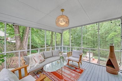 Inviting REAR Covered Porch overlooking outdoor garden & firepit area