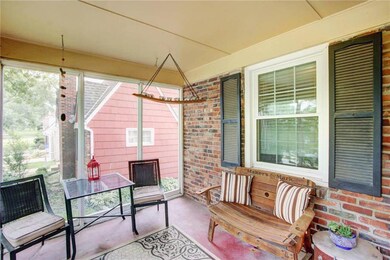 Notice the delightful screened-in front porch, a p