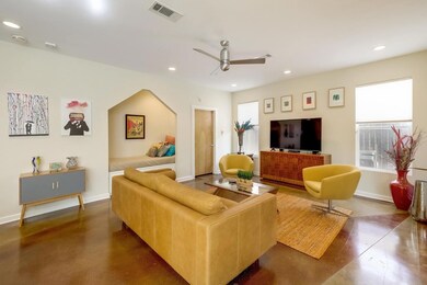 Living room featuring ceiling fan, recessed light