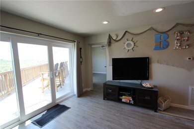 Big screen TV in living area.  Unfurnished otherwi