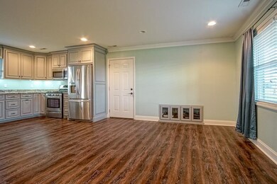 Open living room, kitchen, dining room! Custom cabinets built in for dvd player, cable box, wifi modem, or more! Install your tv above!