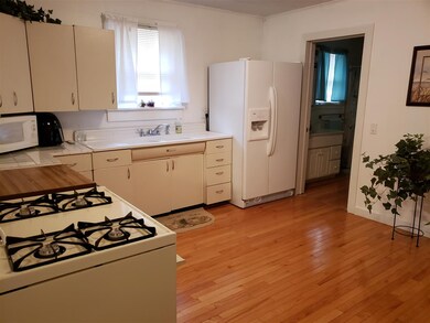 The kitchen has beautiful hard wood oak floors and