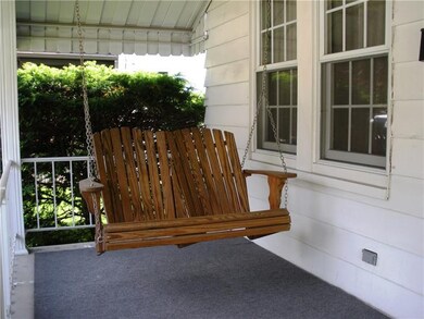 Porch swing is included, a great place to relax