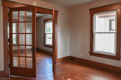 French doors to the formal dining room with wood f