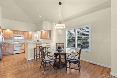 Bright eat-in kitchen and dining area with abundant natural light and flow to the living space