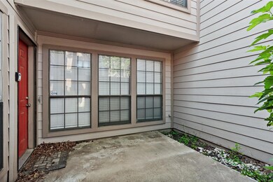 Doorway to property featuring a patio