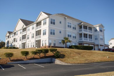 View of building exterior featuring a garage