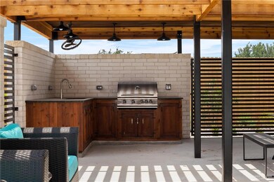 View of patio / terrace with grilling area and a sink