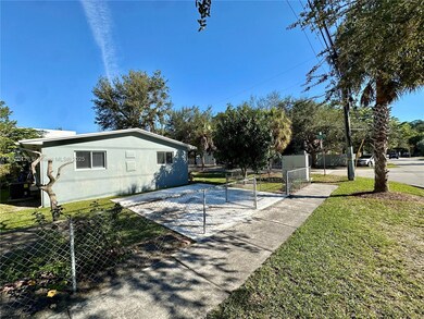 Corner property has private gated parking entrance on Day Avenue.