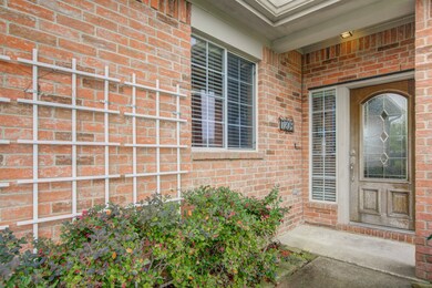 Covered entry provides protection from the elements when you arrive to your palace. Lattice work is a plus for possible jasmine to entice your senses