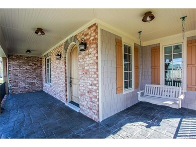 What an inviting front porch with stamped concrete