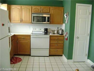 Kitchen. Spacious Kitchen with Tile Countertops and Flooring