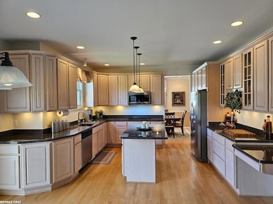 Kitchen on Main Floor overlooks back yard and lake.