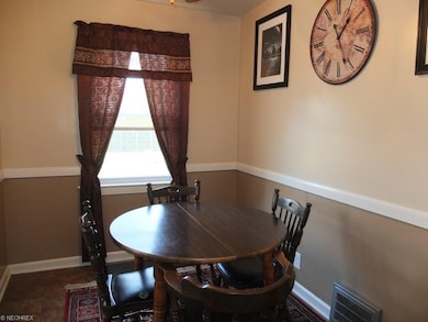 Formal dining room with chair rail.