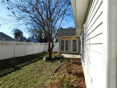 Nice landscaping surrounds this charming home.