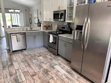 Kitchen with granite counters and stainless appliances
