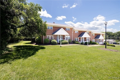 View of front of property featuring a front lawn a