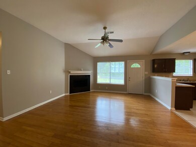 Unfurnished living room featuring light hardwood /