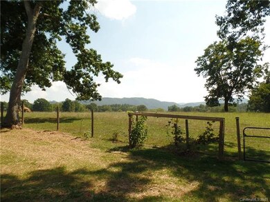 Rear of the back yard, cow pasture & views