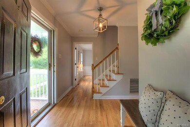 Gleaming wood floors continue from the front foyer