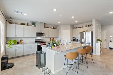 Kitchen featuring stainless steel appliances, a br