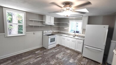 Updated kitchen with new flooring, cabinets, shelv