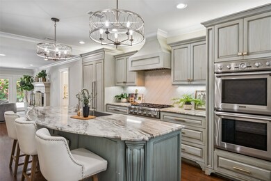 Bar chairs surround the kitchen for an informal lu