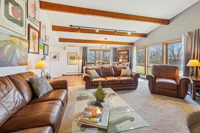 Living room with vaulted beamed ceiling