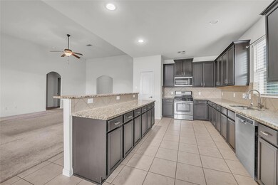 Kitchen featuring appliances with stainless steel