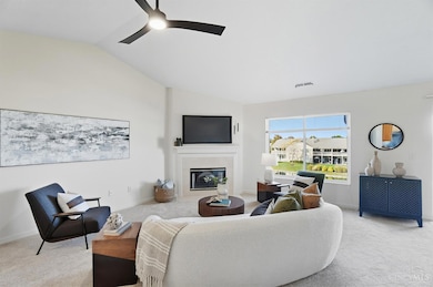 Living room with woodburning marble fireplace and view of the lake & fountain