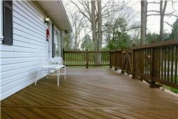 VIEW OF THE FRONT OF THE HOUSE AND PORCH! (deck pictures are from a few years ago...it could use a new coat of deck paint)