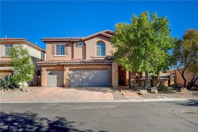 View of front of house with a garage, driveway, a